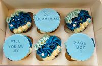 Blue page boy cupcakes